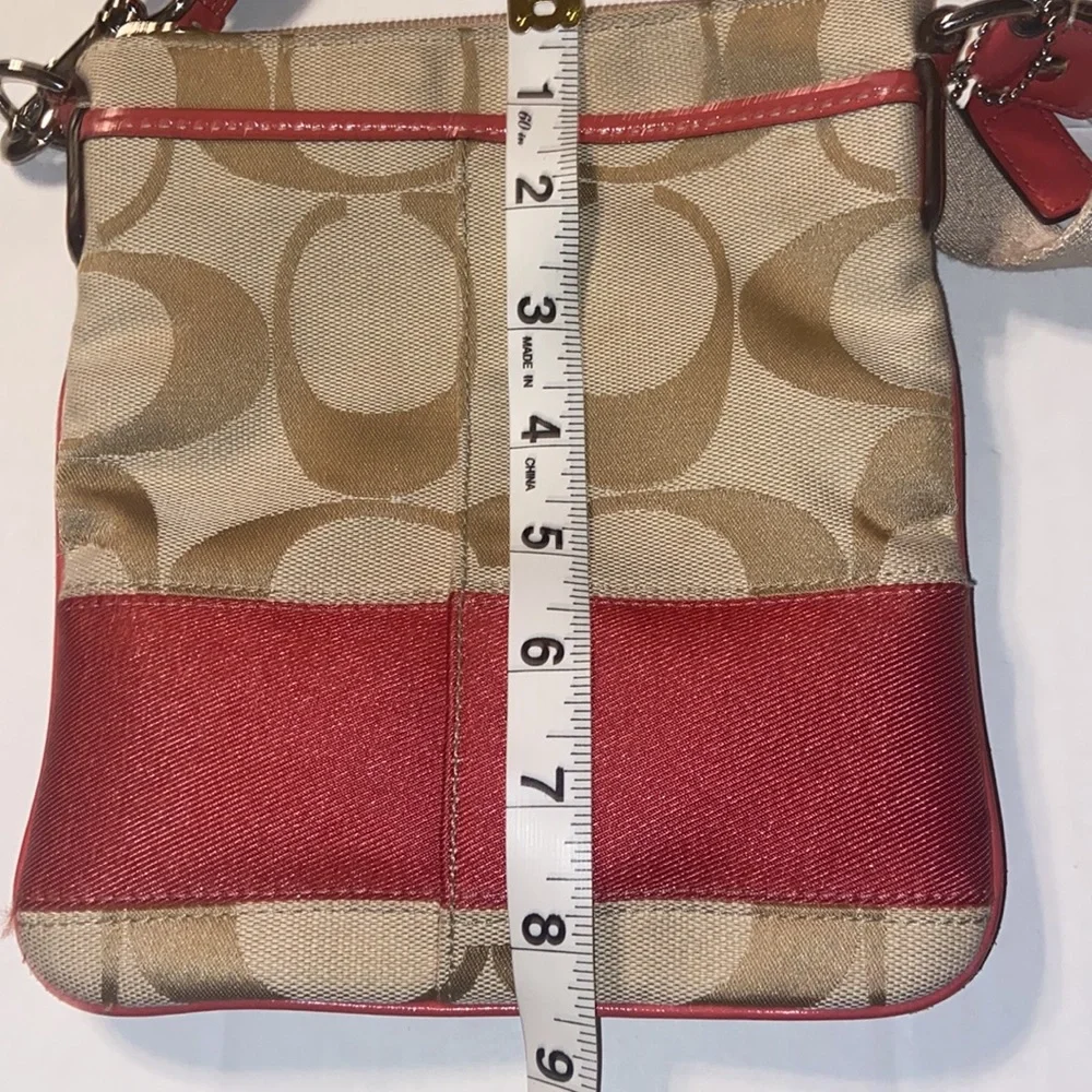 Tan and burnt orange Coach crossbody bag.